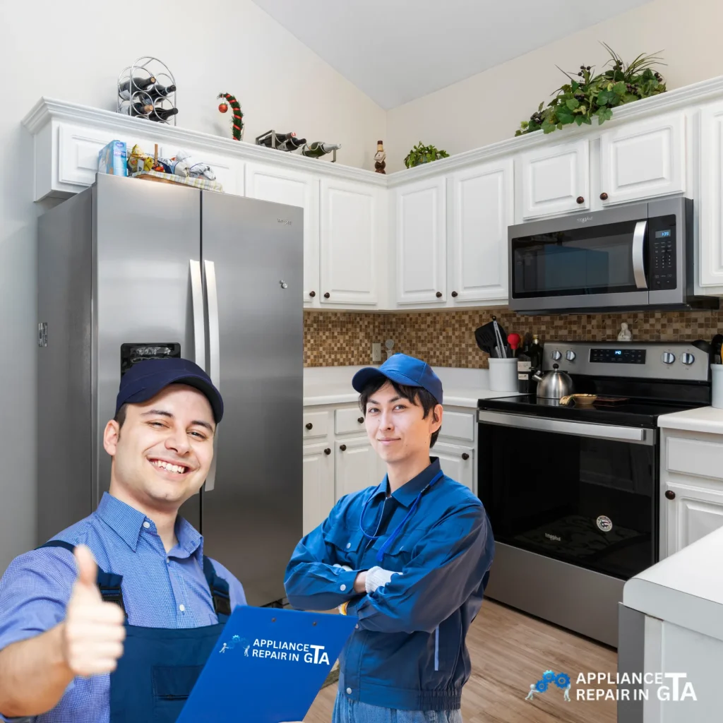 Certified appliance repair technicians in a Vaughan kitchen providing same-day refrigerator and stove repair services.