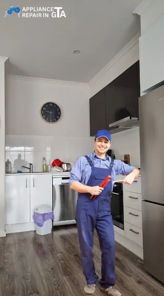 Brampton appliance repair technician servicing a refrigerator and kitchen appliances.