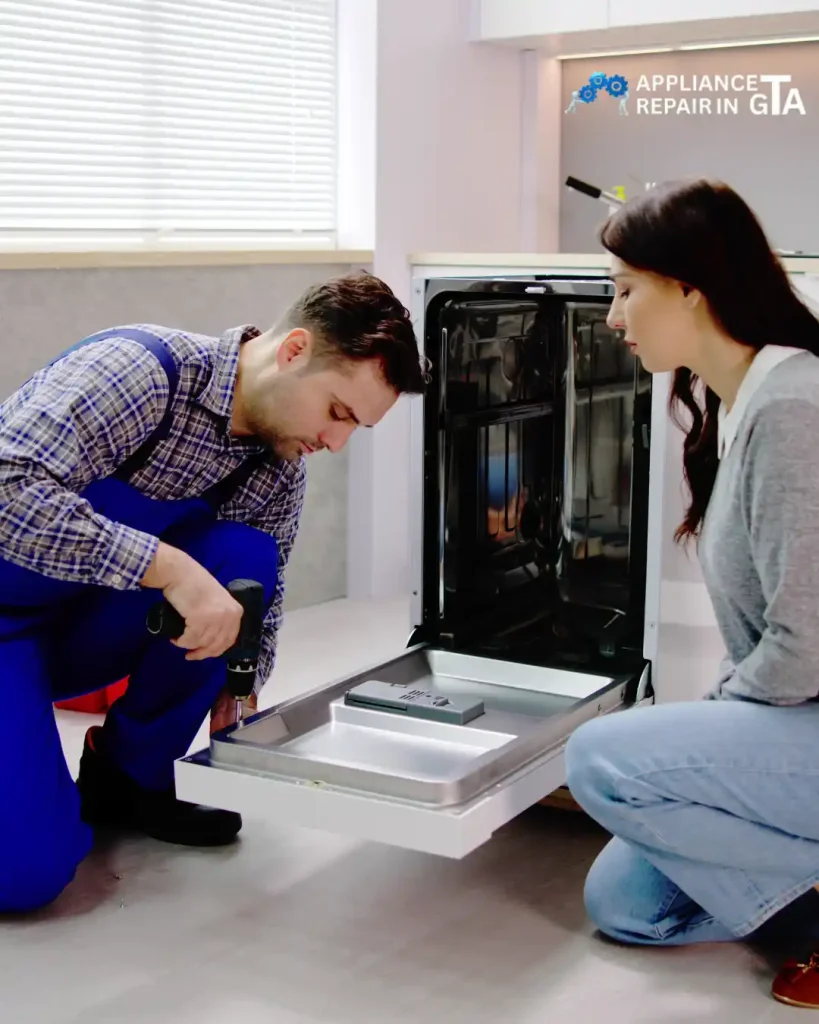 Whirlpool dishwasher repair technician fixing a dishwasher in a Toronto kitchen