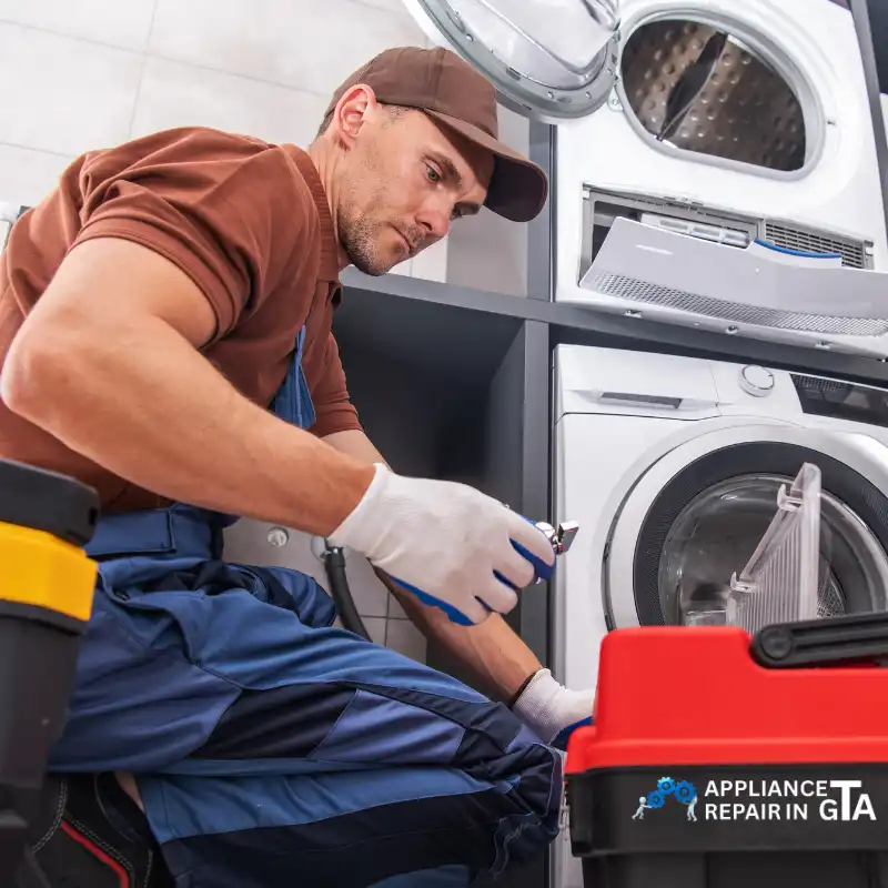 Whirlpool dryer repair technician fixing a clothes dryer in a Toronto home